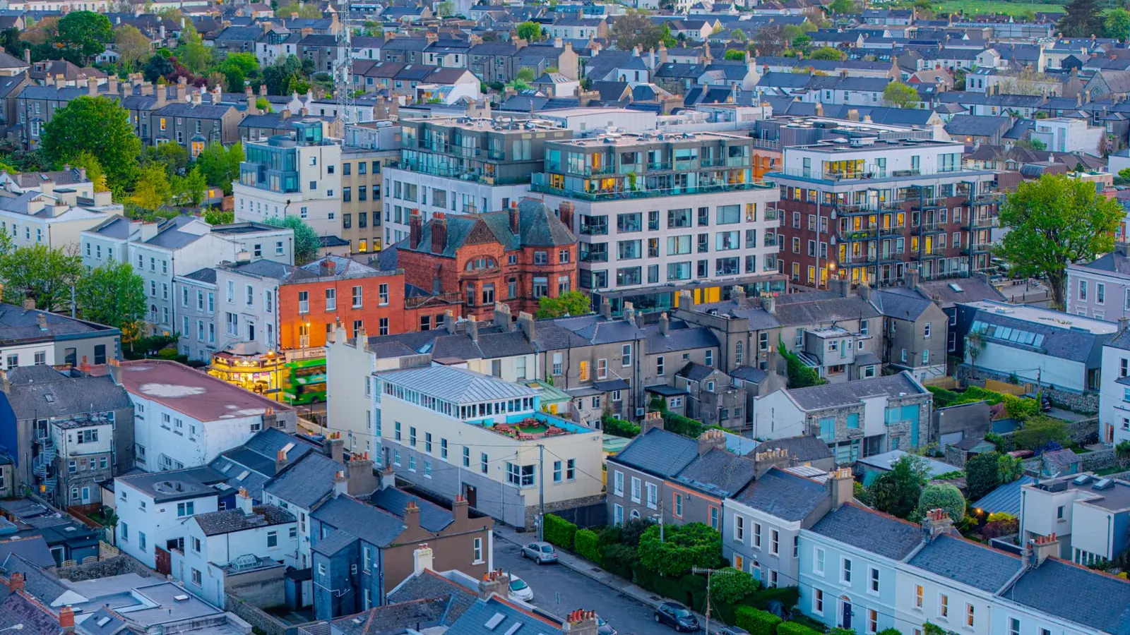 Aerial view of Dublin rooftops at twilight, Georgian terraces beside new apartment blocks
